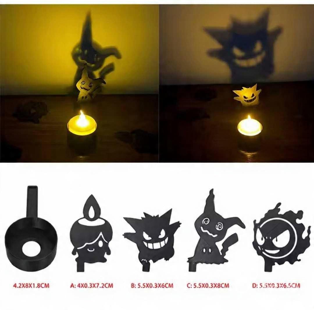 3D-printed Gengar and Mimikyu shadow projector pillars in matte black polymer.