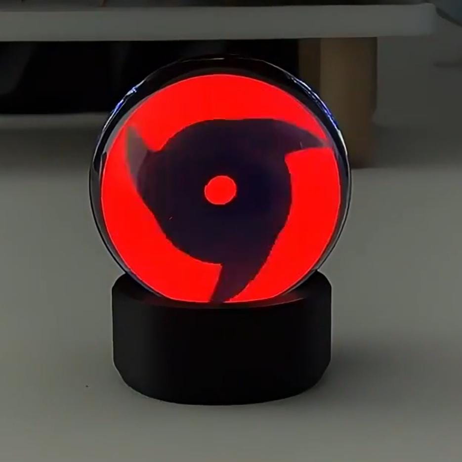 Close-up of the Mangekyo Sharingan evolution on the high-resolution 480x480 LCD orb.