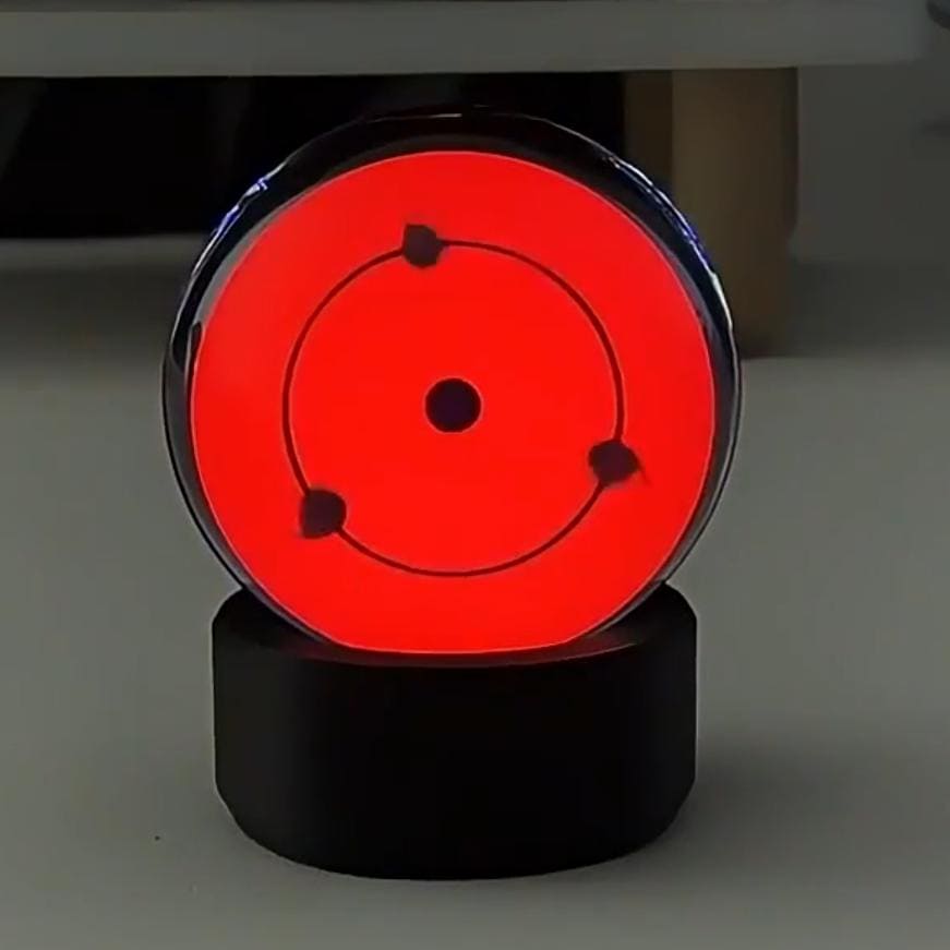 Music-sync reactive mode on the Infinite Sharingan sphere for gaming setups.