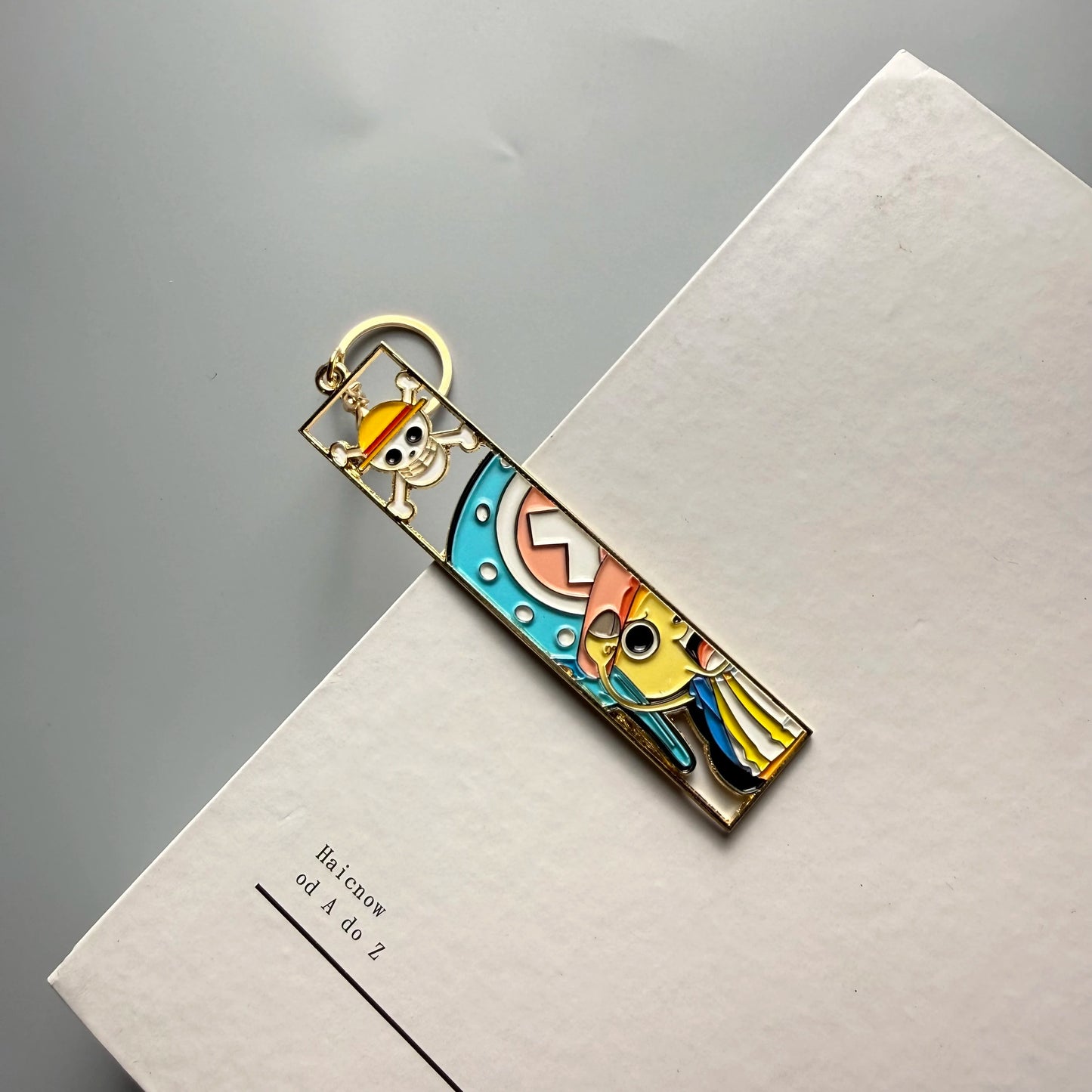 One Piece Hollow-Out Metal Bookmark & Keychain – Gold Anime Bag Tag