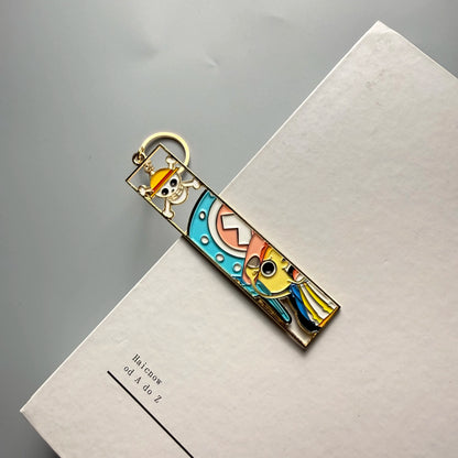 One Piece Hollow-Out Metal Bookmark & Keychain – Gold Anime Bag Tag