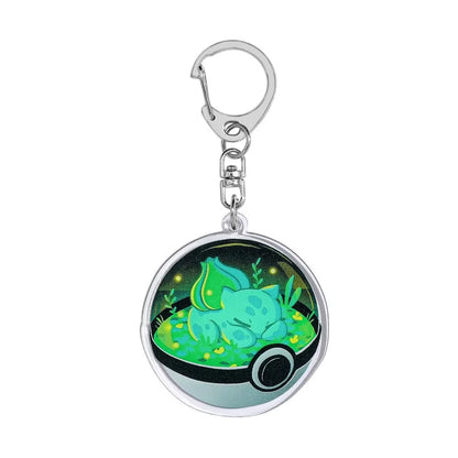 Bulbasaur acrylic keychain with green floral background and reinforced alloy clip.