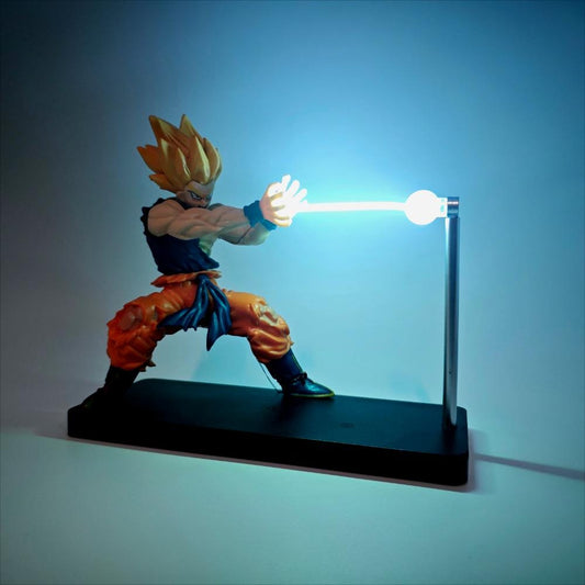 Action figure with a glowing weapon on a stand against a blue background
