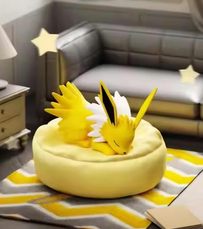 Sleeping Jolteon figure on a bright yellow, star-shaped rug, demonstrating a rare 'cozy' pose for the electric-type Pokémon collectible.